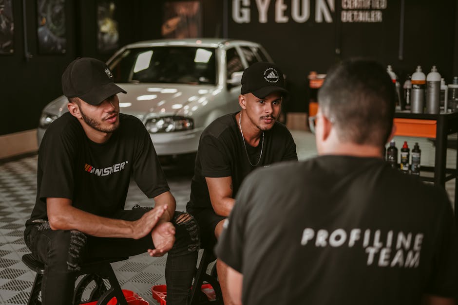 Professional auto detailing team at work